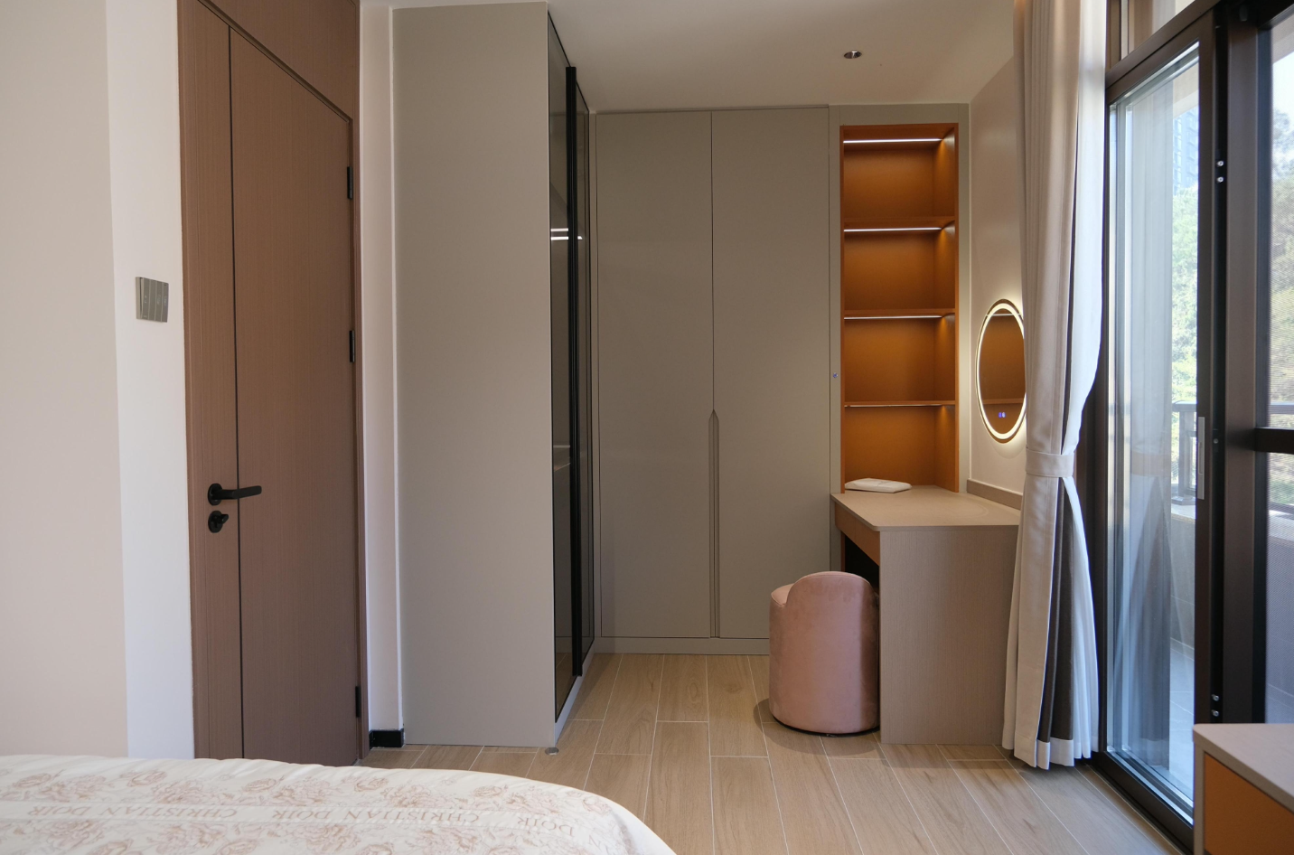 Dressing area with fitted wardrobes and vanity